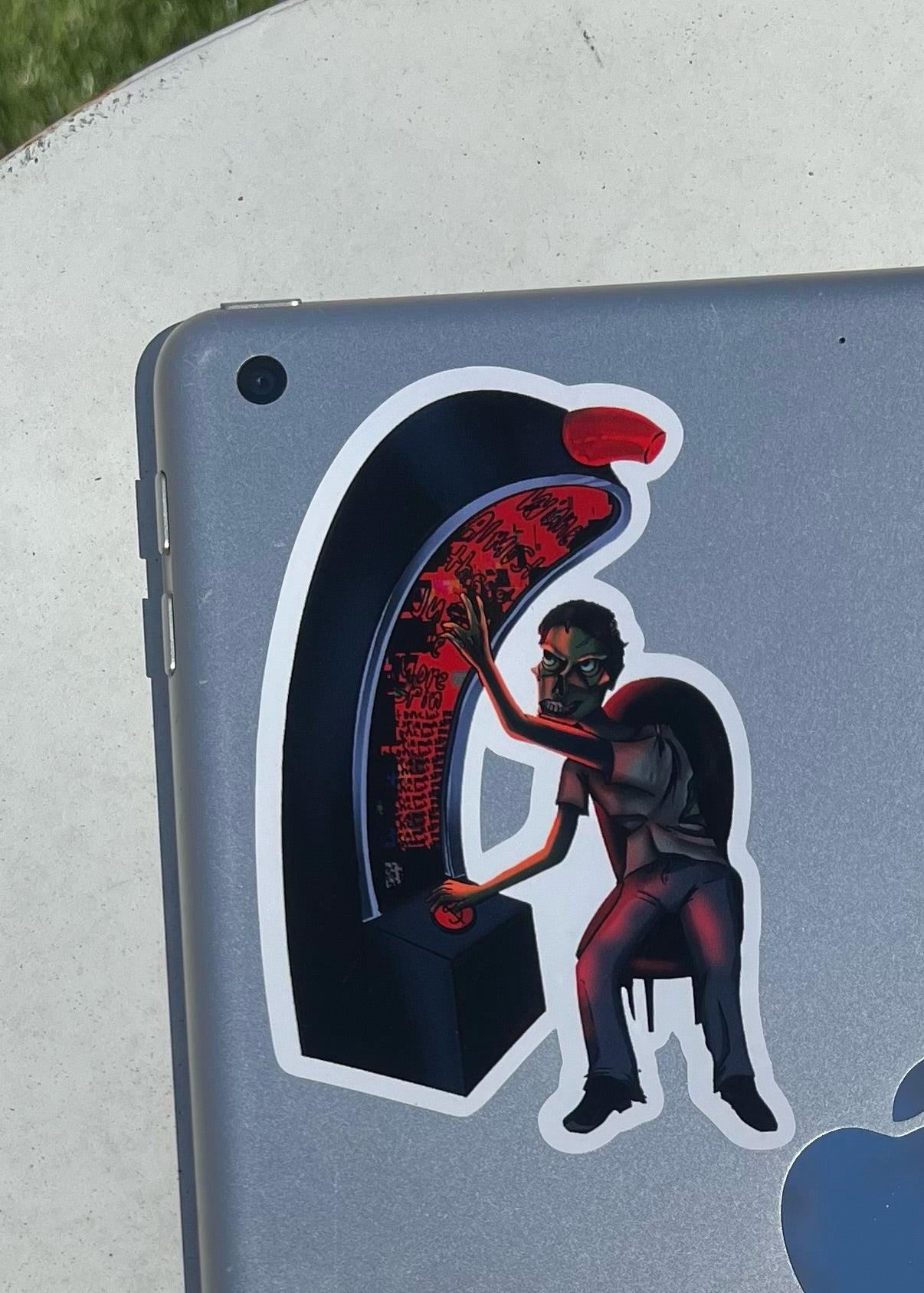 Sticker of a zombie playing a slot machine on a tablet