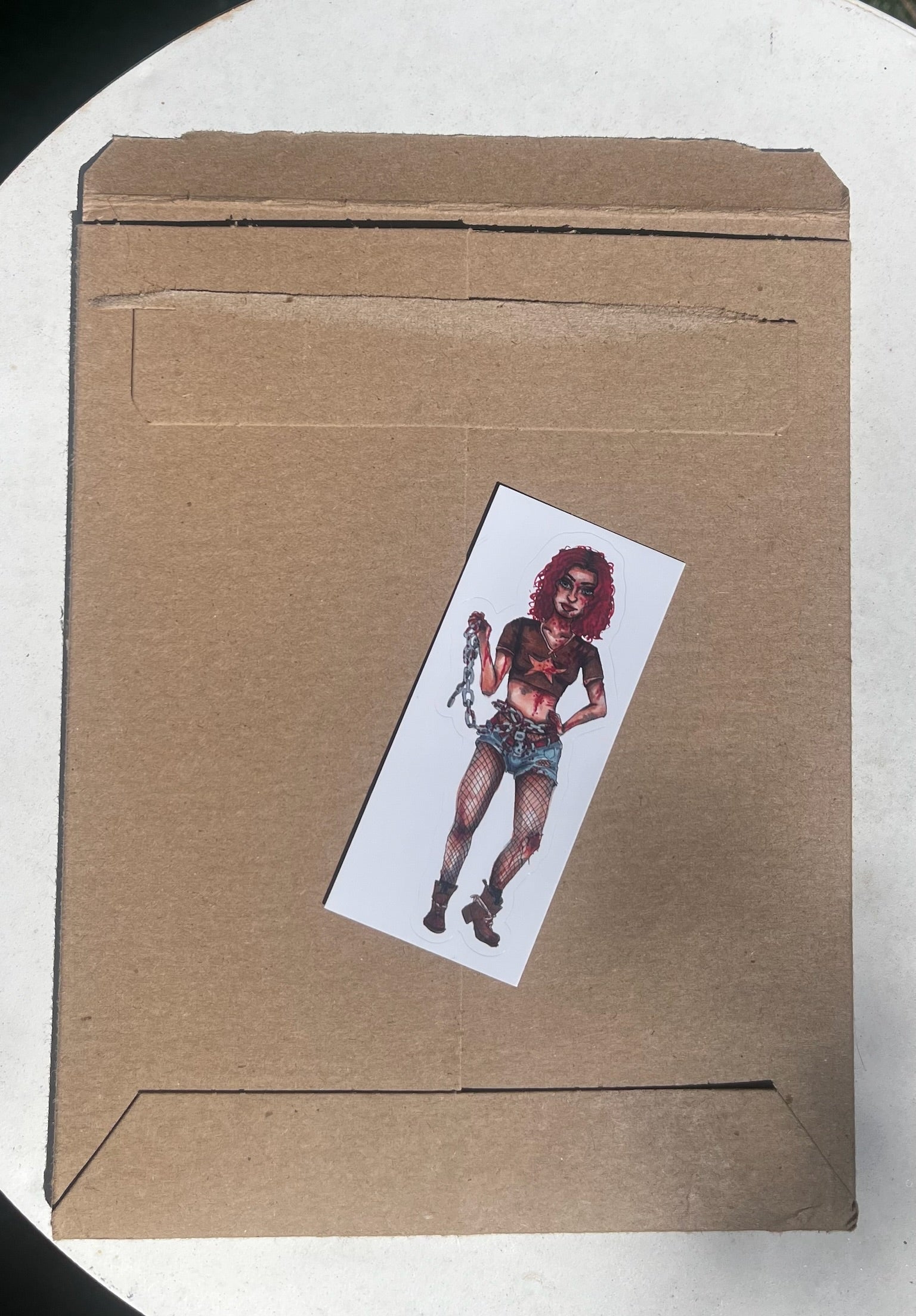 Picture of the shipping packaging for a Sicker of a Woman Zombie Fighter 