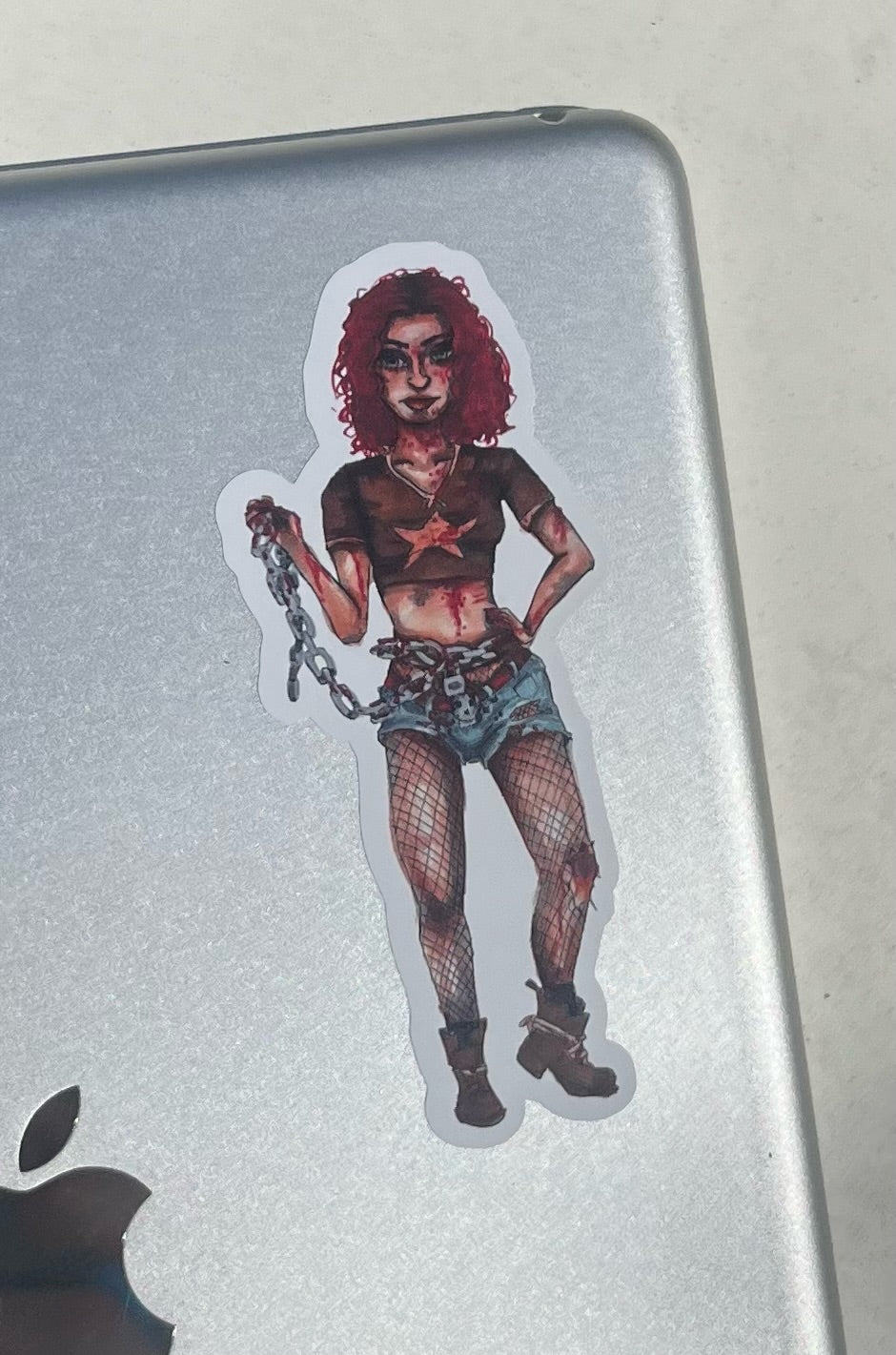 Sicker of a Woman Zombie Fighter on an iPad with a white background